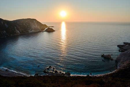 Sunset at Petani Bay on the island of Kefalonia in Greeceの写真素材