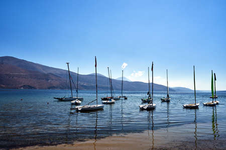sailboats moored to the seashore on the island of Kefalonia in Greece