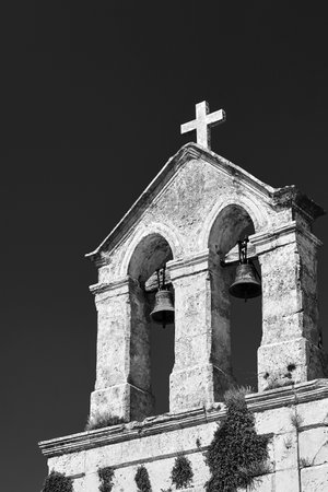 Belfry of the historic Orthodox church in the Zakynthos island in Greece, monochromeの写真素材