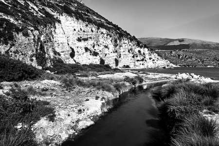 river mouth and rocky sea coast of Cephalonia island in Greece, monochromeの写真素材