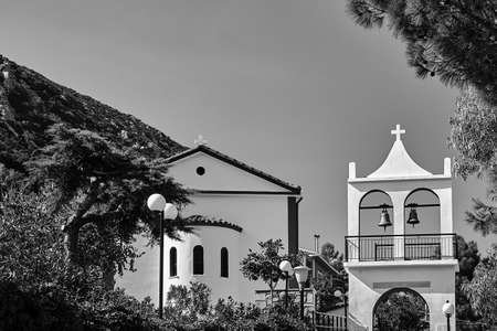 Orthodox church with a belfry on the island of Cephalonia in Greece, monochrome