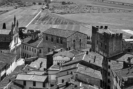 View of the houses and the church from the castle tower of the city of Massa Maritima in Tuscanyの写真素材
