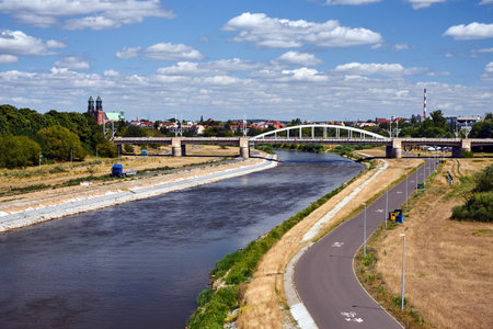 Cityscape with a road bridge across the Warta river in the city of Poznan, Polandの写真素材