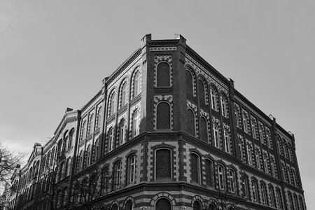facade of a historic brick tenement house in the city of Poznan in Poland, monochromeの写真素材