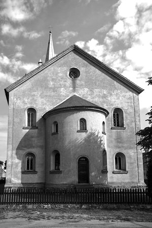The apse of the historic Roman Catholic church in the village of Pieski in Poland, monochrome