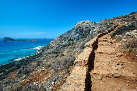 rocky hiking trail in the mountains above the Balos Lagoon on the island of Crete, Greeceの写真素材