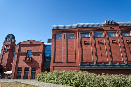 the clock tower and buildings of the former brewery in the city of Poznan, Poland