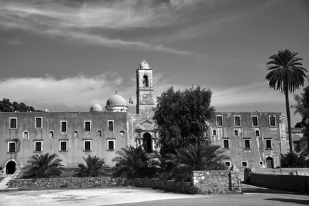 Bell tower, gate and stairs to the historic monastery of Agia Triada on the island of Crete, Greece,...