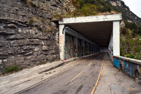 path with a gallery in a rocky slope for pedestrians and cyclists on Lake Garda, Italyの写真素材