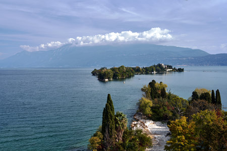 Coast, island and mountains on Lake Garda in Italyの写真素材