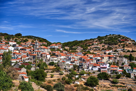 houses and stone orthodox church on hillside on island of Lesbos, Greeceの写真素材
