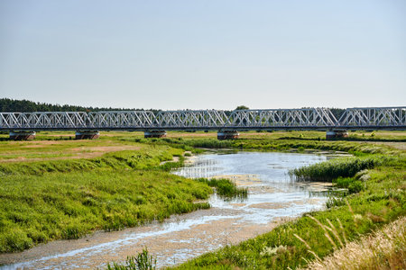 railway bridge over the Warta River near the village of Solec, Polandの写真素材