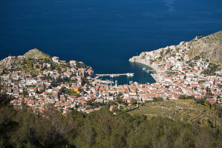View of the traditional greek village with white walls and red roofs, Hydra island, Greeceの写真素材
