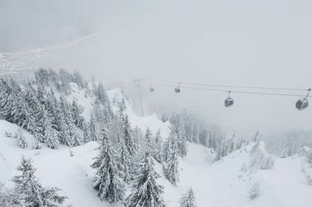 View of the cableway going down to the Chamonix village in winter, Franceの写真素材