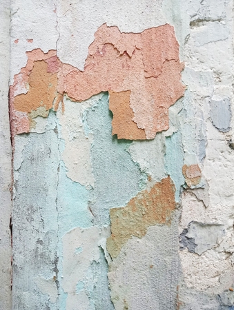 Texture colored old plaster with visible layers of paint.の写真素材