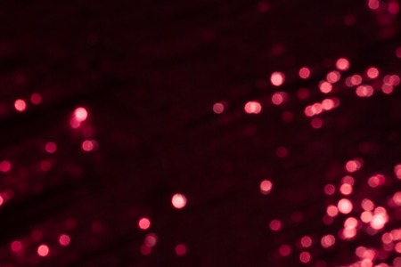 Abstract blurred dark red background with beautiful bokeh effect.の写真素材