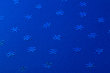 A gentle magic white snowflake from a fairy tale on a light pink background. Flat Lay layout of New Year's decorations and confetti sequins.の写真素材