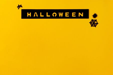 Conceptual halloween layout on a yellow-orange background. Hand made scrapbooking inscription.の写真素材