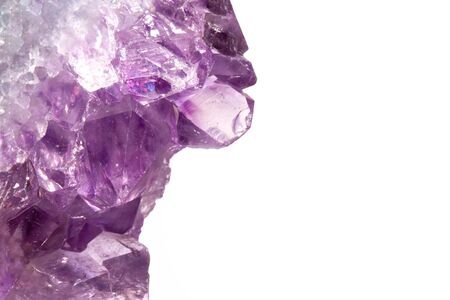 Real macro photo of amethyst natural crystal. Side view. Place for an inscription. Isolated on white background.の写真素材