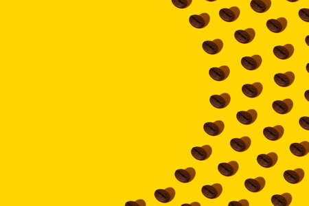 Creative bright collage of real macro photos of selected coffee beans on a yellow background with a...