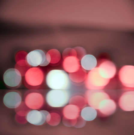 Red and white bokeh background created by lights.の写真素材