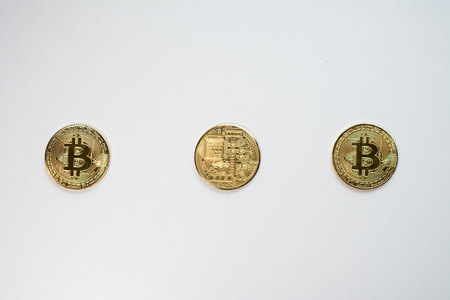 Face and back of the crypto currency golden bitcoin isolated on white background. The concept of virtual international currency and business on the Internet.の写真素材