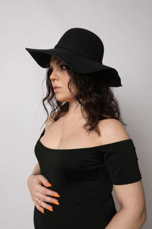 Beautiful young pregnant woman posing in Studioの写真素材