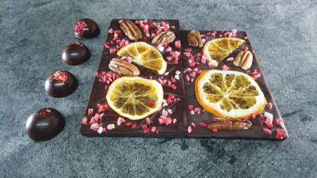 Artisan handmade chocolate. Chocolate bars with dried fruitの写真素材