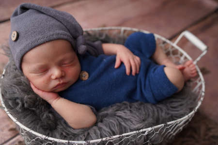 Sleeping newborn boy in the first days of life. Newborn photo session.の写真素材