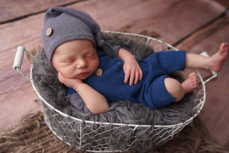 Sleeping newborn boy in the first days of life. Newborn photo session.の写真素材