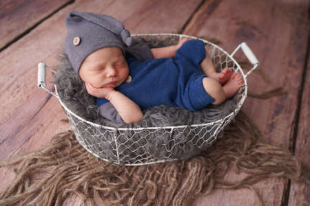 Sleeping newborn boy in the first days of life. Newborn photo session.の写真素材