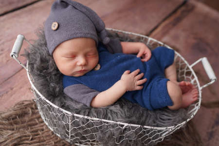 Sleeping newborn boy in the first days of life. Newborn photo session.の写真素材