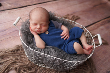 Sleeping newborn boy in the first days of life. Newborn photo session.の写真素材