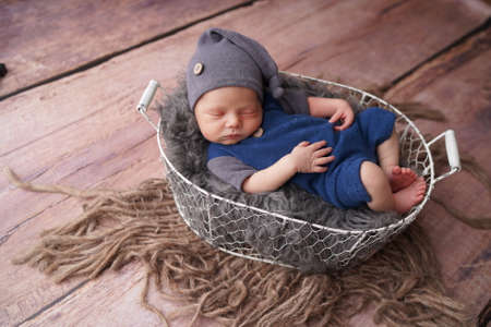 Sleeping newborn boy in the first days of life. Newborn photo session.の写真素材