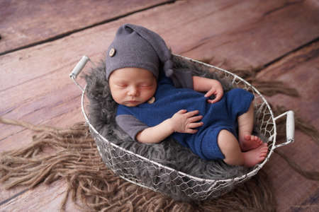 Sleeping newborn boy in the first days of life. Newborn photo session.の写真素材