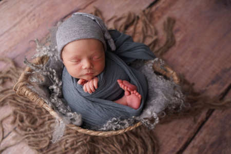 Sleeping newborn boy in the first days of life. Newborn photo session.の写真素材