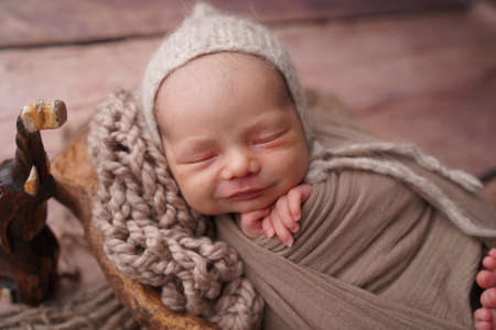 Sleeping newborn boy in the first days of life. Newborn photo session.の写真素材