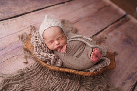 Sleeping newborn boy in the first days of life. Newborn photo session.の写真素材