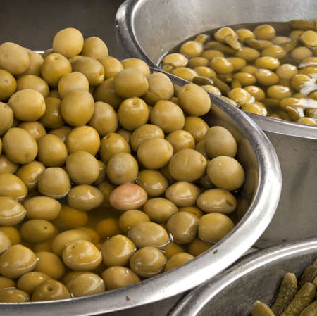 Green olives for sale in the marketの写真素材