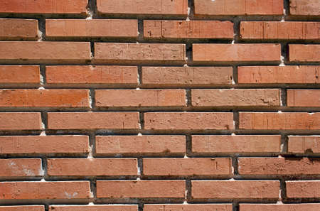 Red brick wall of a house in the streetの写真素材