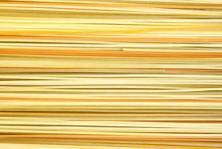 Color Spagetti with vegetables as backgroundの写真素材