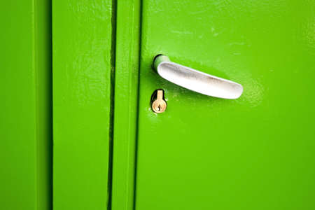 Old green metallic  entrance door の写真素材