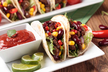 Serving taco with beef and vegetablesの写真素材