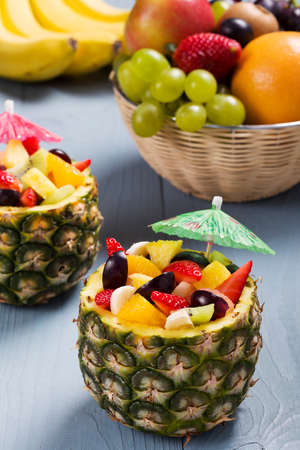 Fresh fruit salad served in bowls with fresh pineappleの写真素材