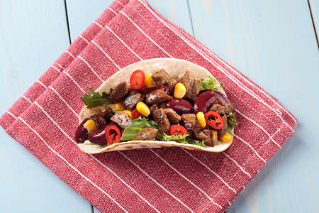 Serving taco with beef and vegetablesの写真素材