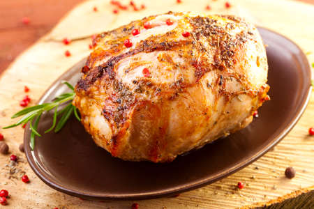 Marinated roast ham on wood boardの写真素材