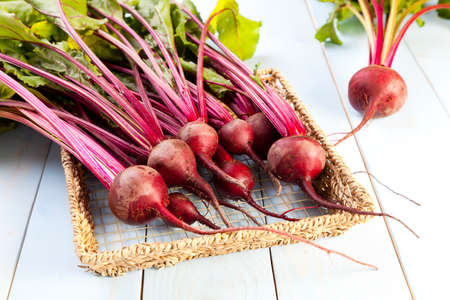 Fresh beets on a wooden board