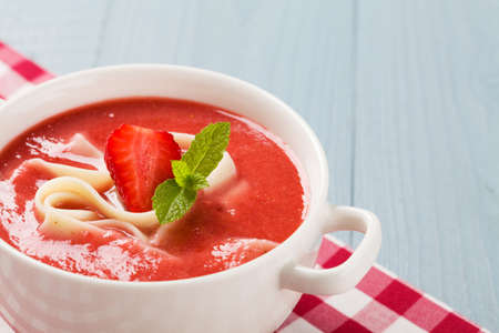 Home made soup with strawberries. Served with noodles in hot summer days.の写真素材