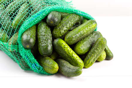 fresh cucumbers on wood boardの写真素材