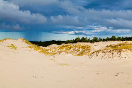 Sand dunes on the Baltic coast in the morning - storm cloudsの写真素材